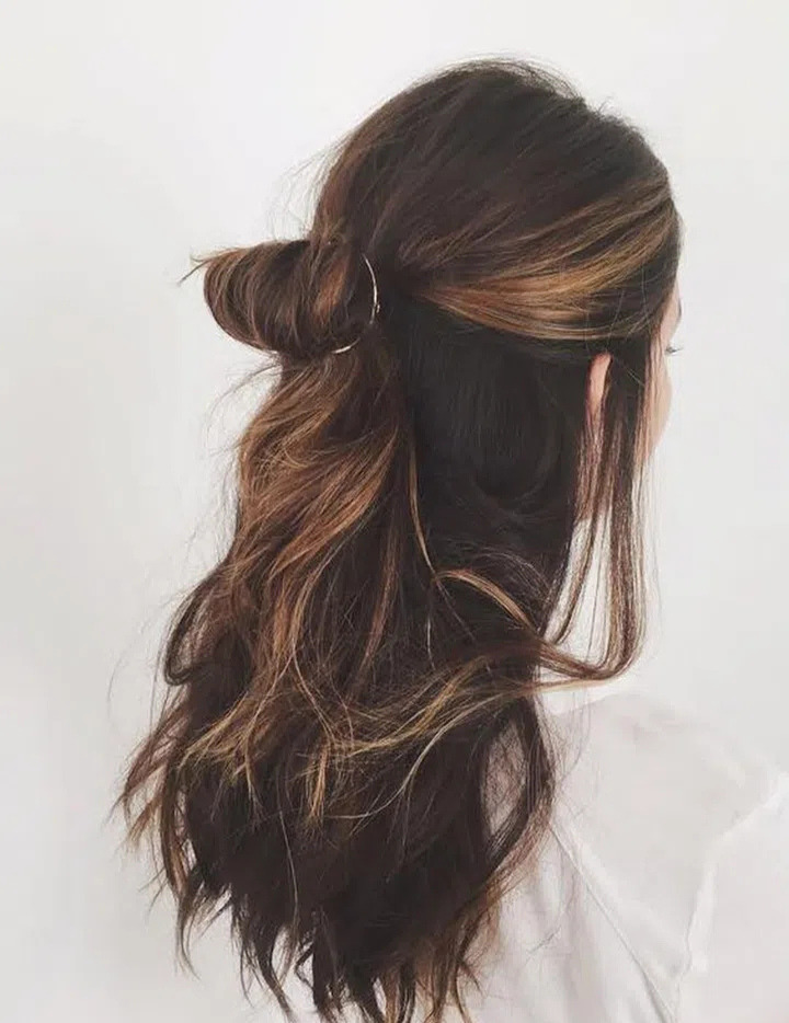 half up half down bun hairstyle